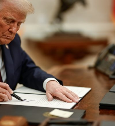 President Trump beginning to sign executive orders on Jan. 21, in the Oval Office of the White House. (Photo: @WhiteHouse
)