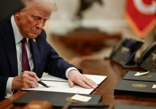 President Trump beginning to sign executive orders on Jan. 21, in the Oval Office of the White House. (Photo: @WhiteHouse
)