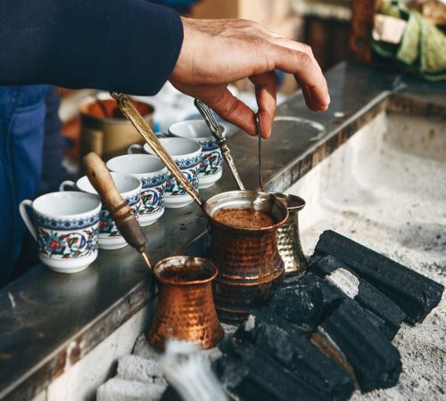 Traditional Turkish charcoal coffee. Cooking fresh aromatic traditional Turkish coffee on charcoal. (Photo: © Franz1212
| Dreamstime.com)