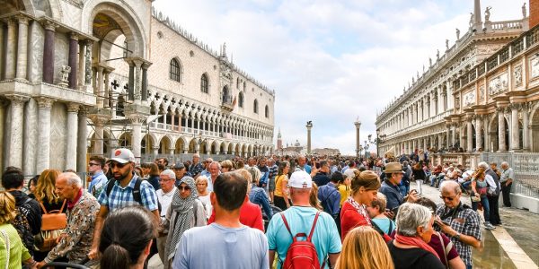 The visible effects of overtourism as cruise ship passengers crowd the walkway at the Doge`s Palace in Piazza San Marco on a busy day in Venice, Italy. (Photo:© Kirk Fisher/Dreamstime.com)