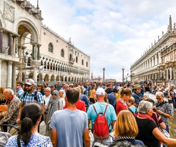 The visible effects of overtourism as cruise ship passengers crowd the walkway at the Doge`s Palace in Piazza San Marco on a busy day in Venice, Italy. (Photo:© Kirk Fisher/Dreamstime.com)