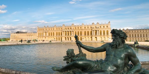 Pond with statue and Palace Versailles in France. (Photo: © Peter Apers/Dreamstime.com)
