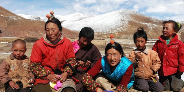 Family members on the highlands of Tibet. (Photo: © Bbbar | Dreamstime.com)