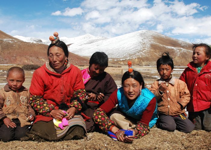 Family members on the highlands of Tibet. (Photo: © Bbbar | Dreamstime.com)