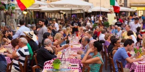 People having aperitif which in Italy traditionally includes free all you can eat buffet of pizzas and pastas, on Piazza Campo DÃ¨ Fiori in Rome. (Photo:© Kasto80 | Dreamstime.com )
